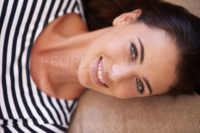 Buy stock photo Woman, portrait and peace to relax on couch, chill and smile while lazy or comfortable in home. Female person, happy and resting on sofa in living room, closeup and mindfulness or calm confidence