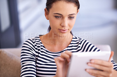 Buy stock photo Woman, tablet and online connection on sofa in apartment for movie streaming with technology, communication or social media. Female person, browsing and couch in home for web, internet or download