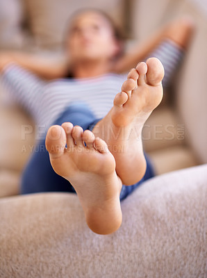 Buy stock photo Woman, nap and feet to relax on couch, dream and lying while lazy or comfortable in home. Female person, closeup and sleep on sofa in living room, peace and calm for wellness and tired or exhausted