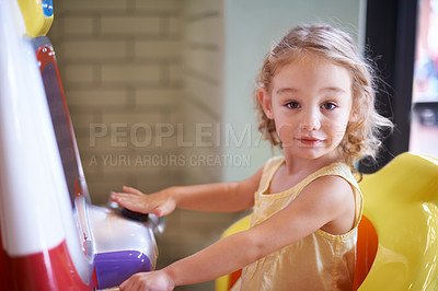 Buy stock photo An adorable little girl playing games indoors