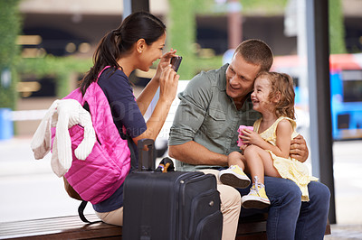 Buy stock photo Parents, child and suitcase or photo for vacation memory at airport for travel, bonding or family. Mother, father and daughter for picture with smartphone for America trip, luggage or adventure
