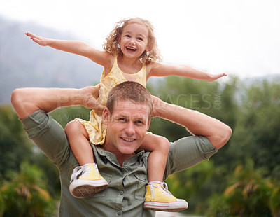 Buy stock photo A young girl on her dad's shoulders