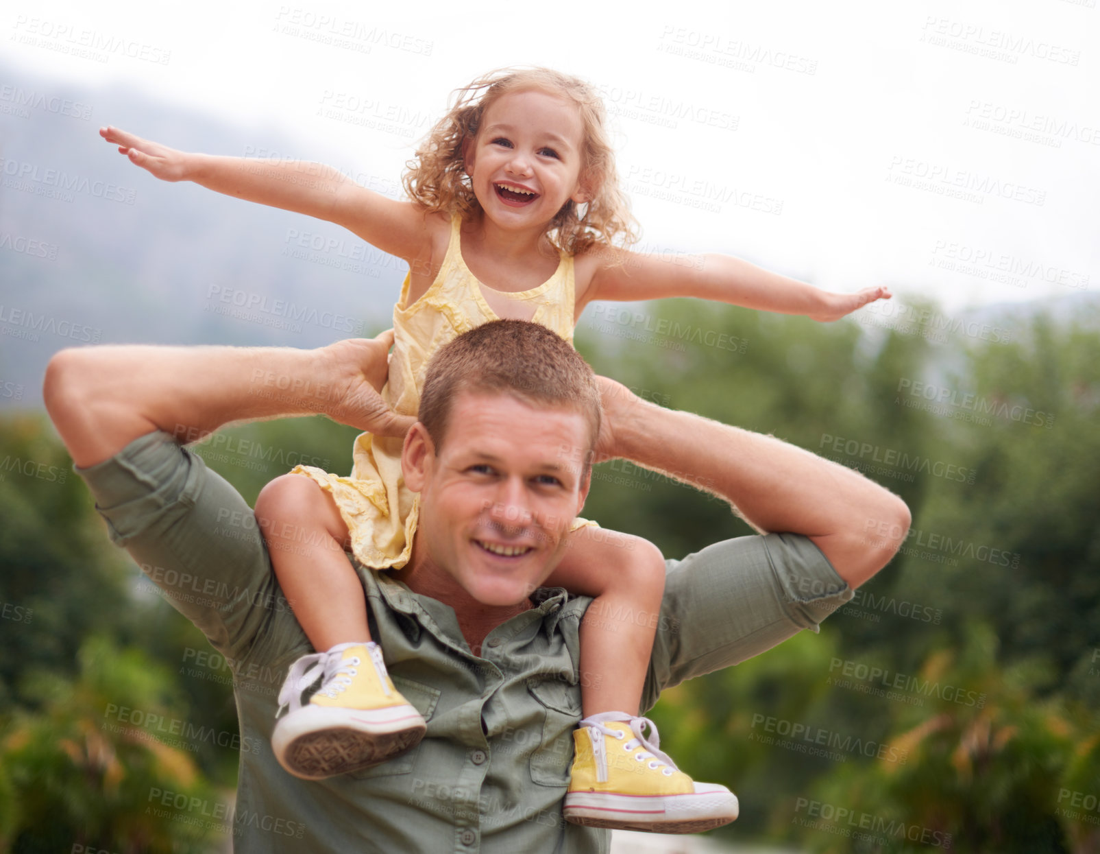 Buy stock photo A young girl on her dad's shoulders