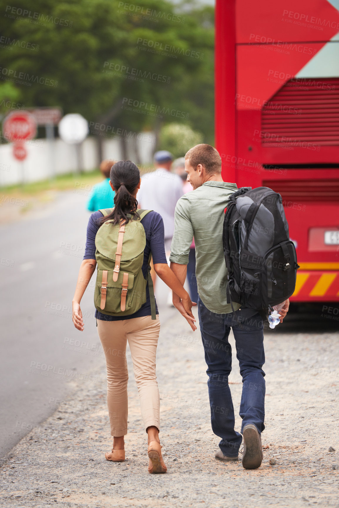 Buy stock photo Couple, holding hands and bus for travel on vacation with back, walking and luggage in street with chat. Man, woman and people with connection, love and bonding on holiday for road trip in Costa Rica