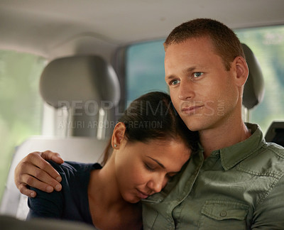 Buy stock photo Love, taxi and couple hug in a car with trust, support and safety, peace and bonding on commute. Travel, passenger and people embrace on a backseat of cab, transport or journey on chauffeur service
