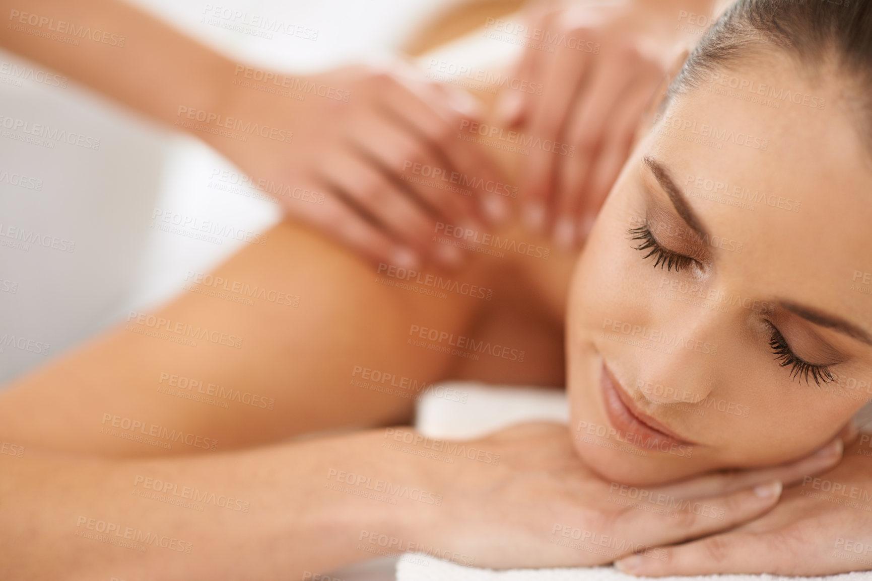 Buy stock photo Cropped shot of a gorgeous young woman enjoying a massage