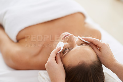 Buy stock photo Woman, cotton and facial massage for treatment to relax, cosmetics and beauty therapy for skin care. Female person, calm and serene or dermatology, closeup and pampering at hotel and peace or zen