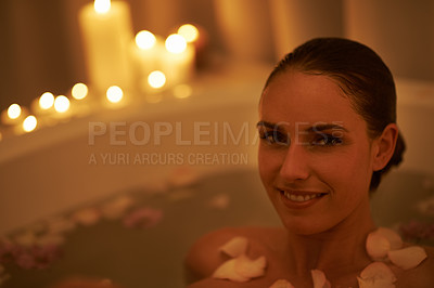 Buy stock photo Woman, portrait and bath with candles or spa self care or cleaning routine with petals for treatment, hygiene or wellness. Female person, face and stress relief skincare with peace, tub or comfort