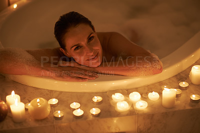 Buy stock photo Woman, portrait and bath with candles or relax self care or cleaning routine with bubbles for treatment, hygiene or wellness. Female person, face and stress relief skincare with peace, tub or comfort