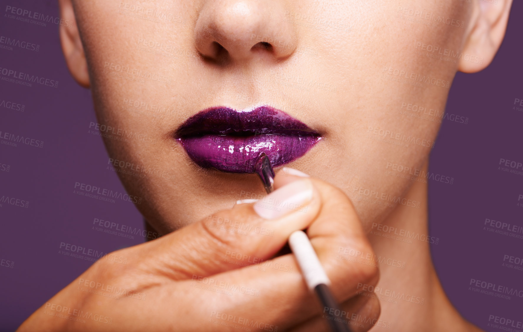 Buy stock photo Lipstick, beauty and mouth of woman on purple background for makeup, cosmetics and products. Salon aesthetic, creative and closeup of lips of person with lipgloss, shine and cosmetics in studio