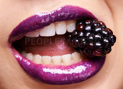 Buy stock photo Woman lips closeup, purple lipstick with blackberry and makeup, shine and creativity with beauty. Fruit between female model teeth, cosmetics product and cosmetology, mouth with shiny lip gloss