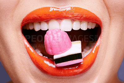 Buy stock photo Beauty, lipstick and woman with sweets in mouth, makeup and creativity with closeup of shiny cosmetic product. Licorice, candy and orange lip gloss for aesthetic, art and cosmetology with glamour