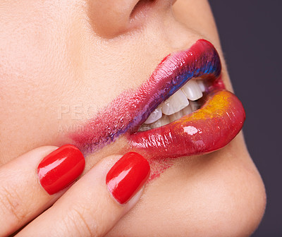 Buy stock photo Lipstick, smear and woman for beauty with hand, makeup and red nail polish with cosmetic product in studio. Face, smudge on skin and color for cosmetology with manicure, creativity and glamour