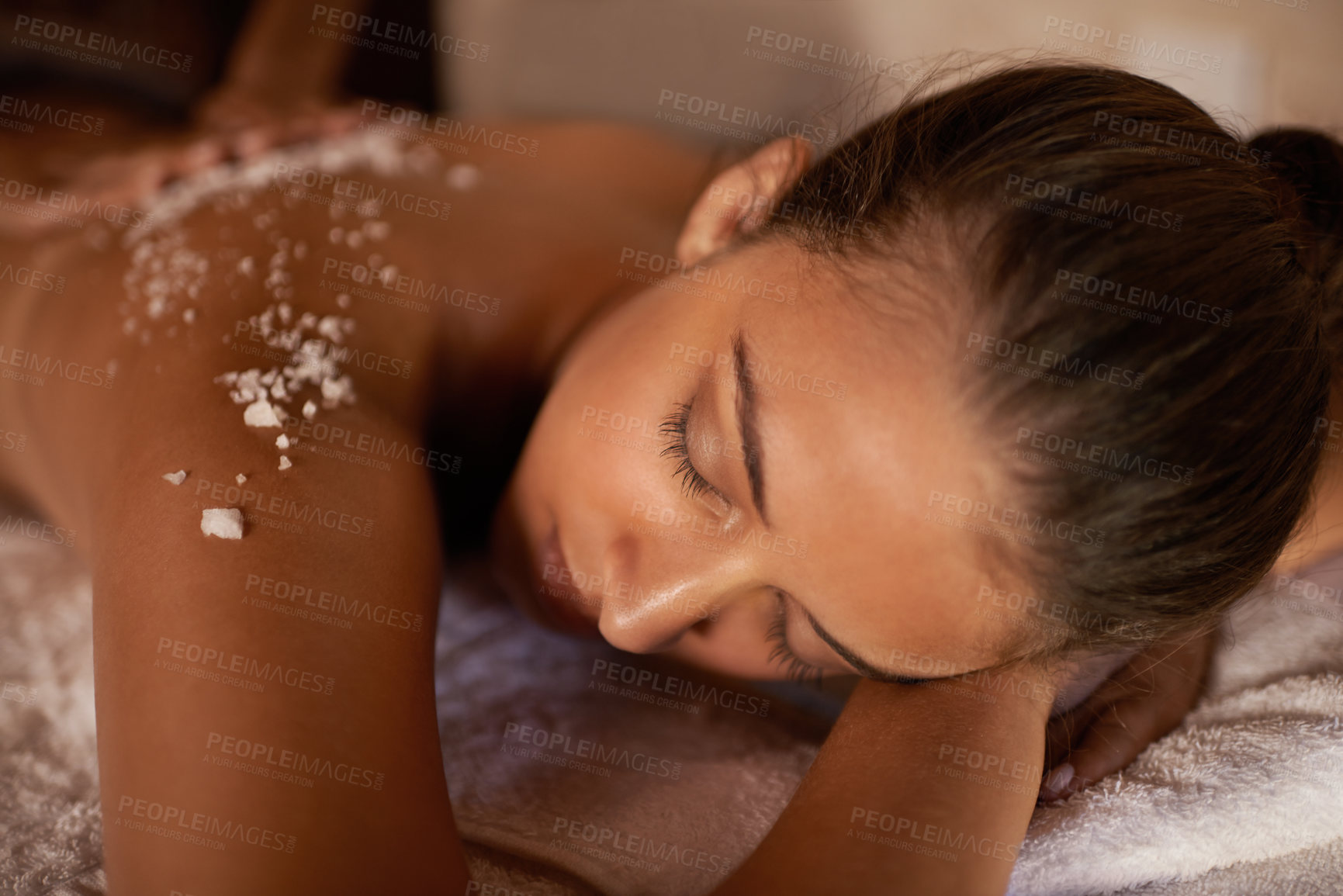 Buy stock photo Spa, relax and holistic body massage of a woman with beauty specialist with salt treatment. Exfoliate, female person back and detox application for skin and calm wellbeing at a hotel with care
