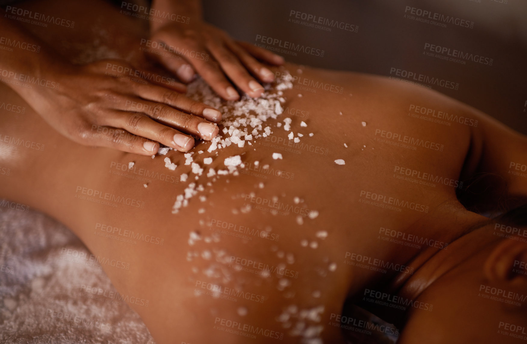 Buy stock photo Salt, spa scrub and beauty therapist hands with woman customer at a hotel with massage. Exfoliate therapy, luxury and relax treatment of a female person back for skincare and wellness exfoliation