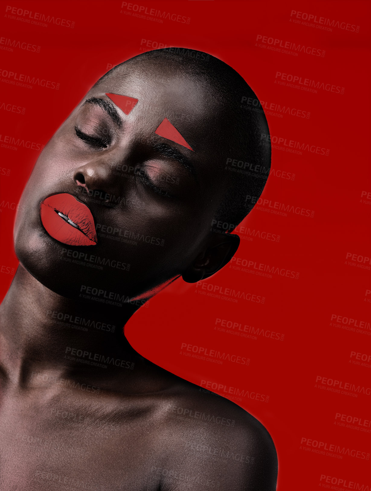 Buy stock photo Black woman, makeup and artistic with red, skin and creative with studio and color. Model, closeup and face paint for cosmetics, contrast and aesthetic for glamour isolated on background for beauty