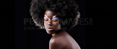 Buy stock photo African woman, makeup and eyeshadow with beauty, skin and creative with studio and color. Model, closeup and face paint for artistic, contrast and aesthetic for glamour isolated on black background
