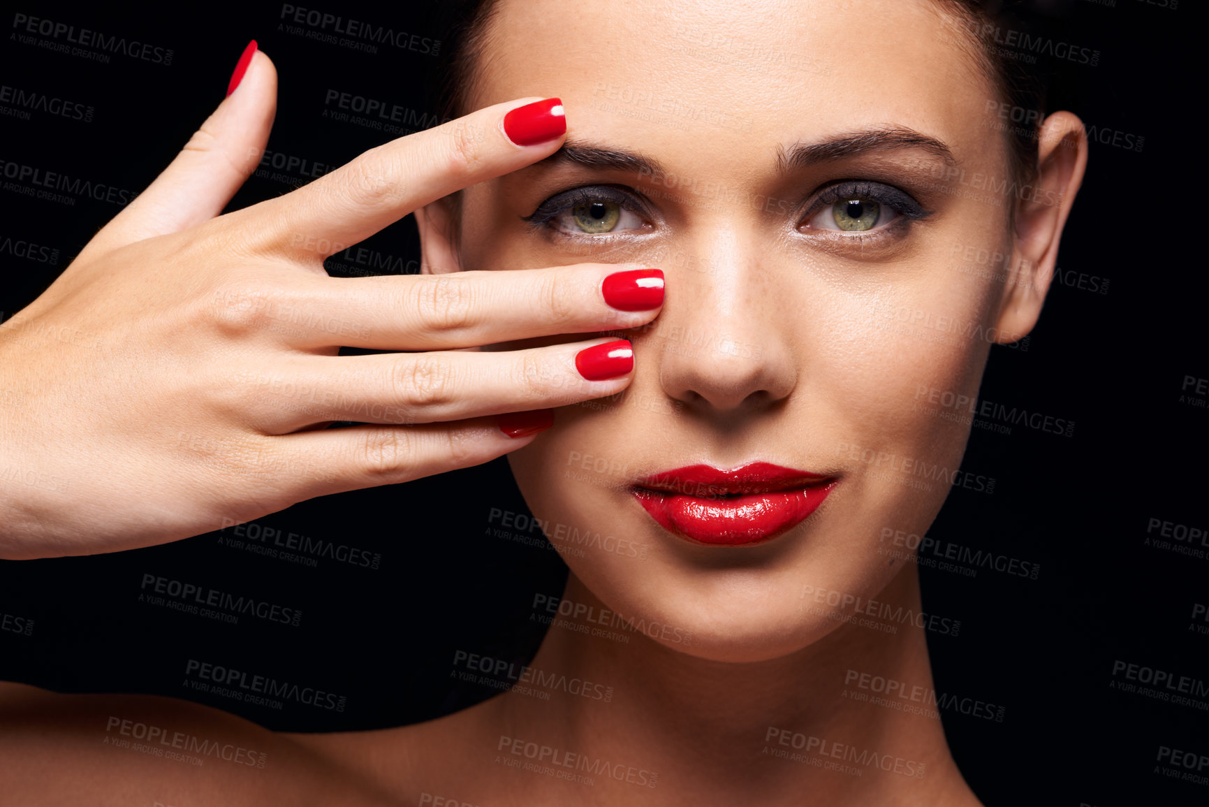 Buy stock photo Manicure, red lips and portrait of woman in studio with makeup, trendy and beauty face routine. Nail polish, hand and young female person with facial cosmetics treatment isolated by black background.
