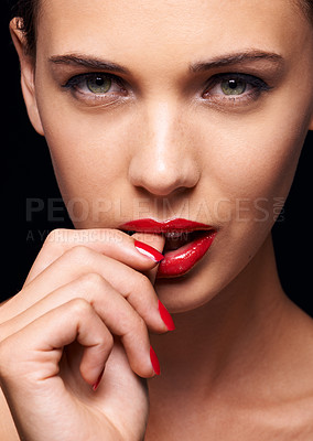 Buy stock photo Beauty, makeup and portrait of woman for skincare in studio with manicure on hand isolated on a black background. Cosmetics, model and face of person with red lipstick on mouth, serious or bite thumb