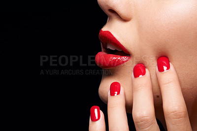 Buy stock photo A cropped studio shot of a beautiful model wearing red lipstick and nailpolish