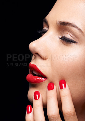 Buy stock photo Manicure, makeup and woman with red lipstick and nails in a studio with a self care pamper treatment. Cosmetic, beauty and closeup zoom of a female model with a facial routine by a black background.