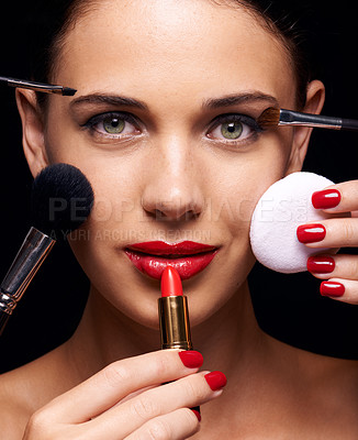 Buy stock photo A beautiful young woman having various make up techniques tried on her face