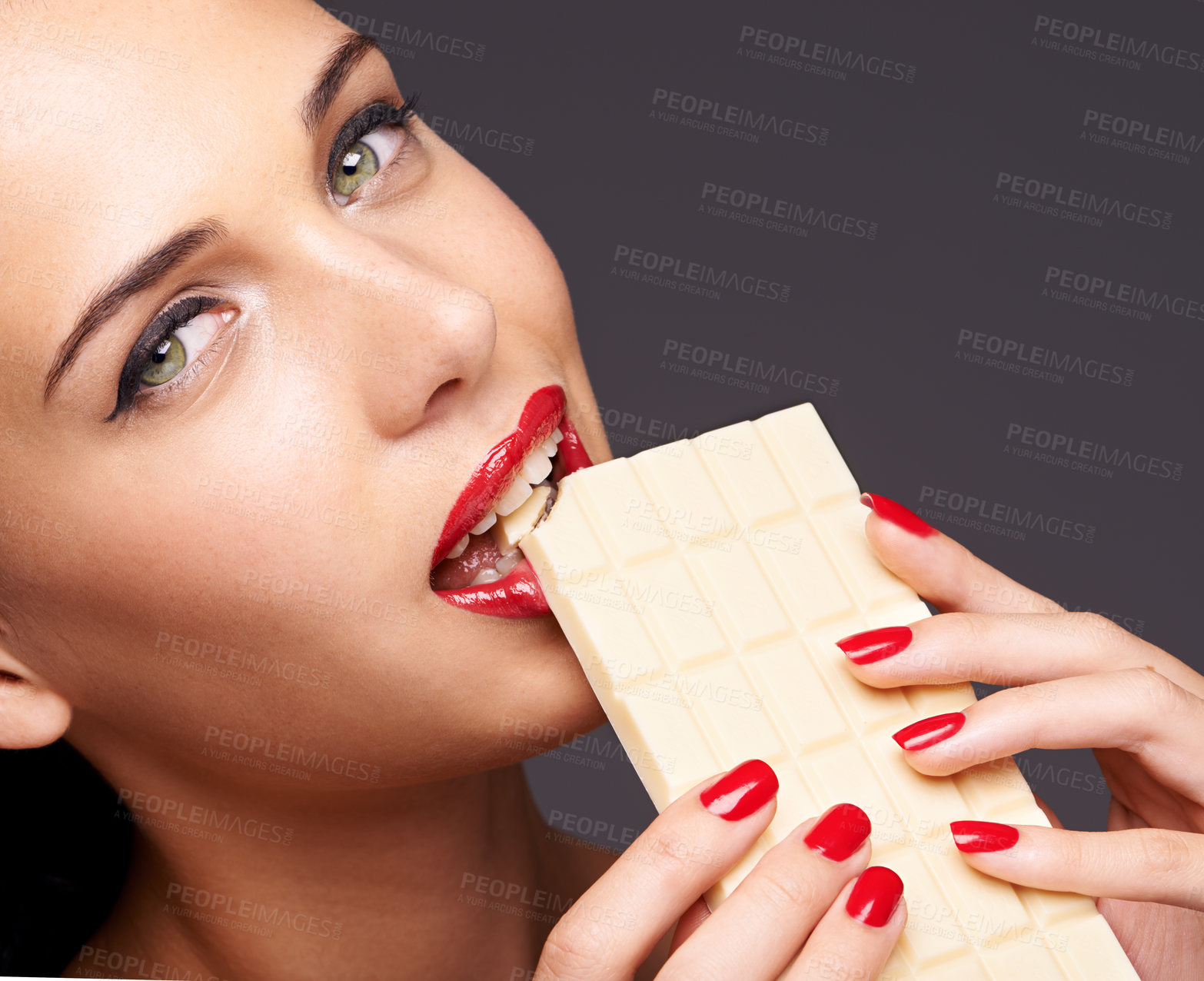 Buy stock photo Portrait, beauty and woman with chocolate in studio for lipstick cosmetics, manicure and makeup in gray background. Sweets, closeup and face of model for cocoa product, unhealthy snack or bite candy