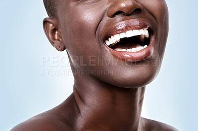 Buy stock photo Mouth of woman, happy or laughing with beauty, cosmetics or healthy skin for shine isolated in studio. Face, closeup or funny girl model with lip gloss, smile or skincare results on blue background