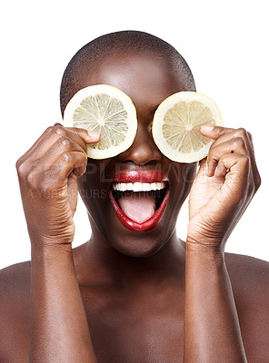 Buy stock photo Black woman, excited and lemon skincare in studio for organic dermatology routine, youth or wellness. White background, happy or African model with facial glow, fruit diet and eyes product for beauty