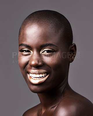 Buy stock photo Portrait, skincare and makeup with bald black woman in studio on gray background for natural wellness. Face, beauty and smile with happy young model at spa for cosmetics, facial or dermatology