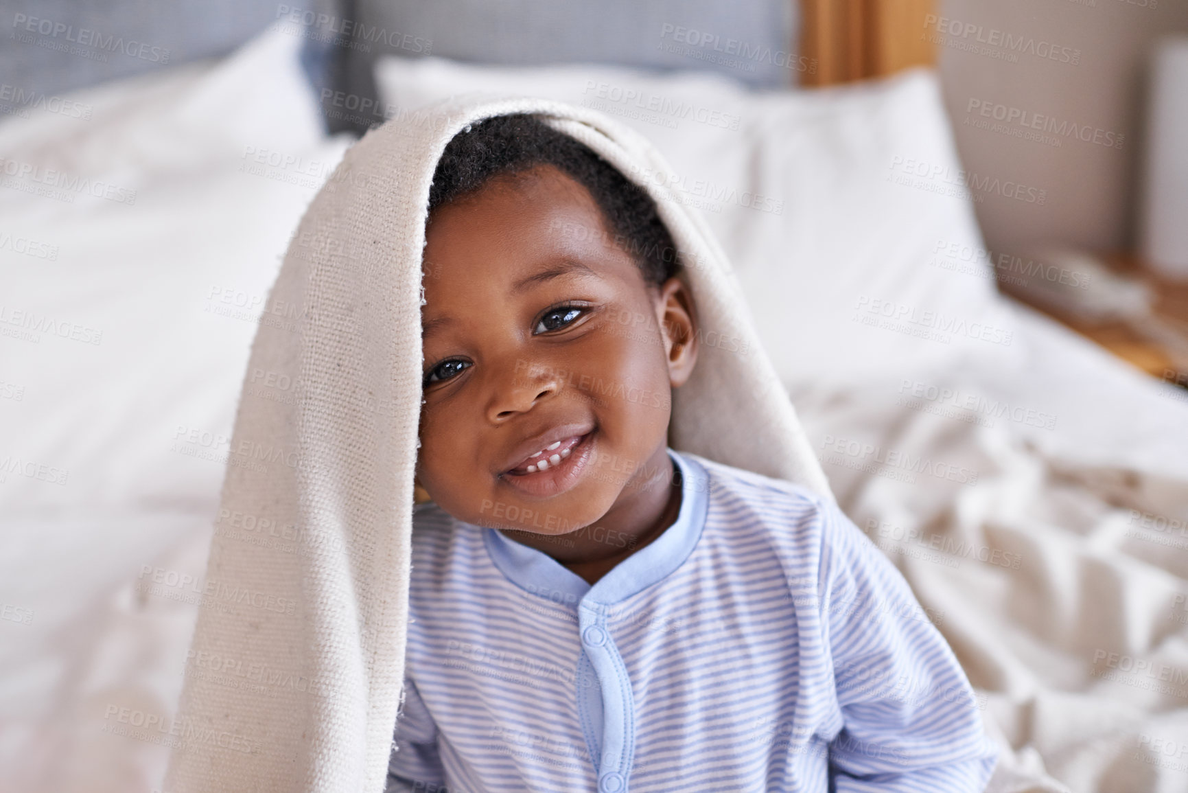 Buy stock photo Portrait, happy and baby with a blanket in bed, waking up and playing in his home. Face, smile and african boy toddler in a bedroom curious, having fun and sweet, cute and playful  while relaxing