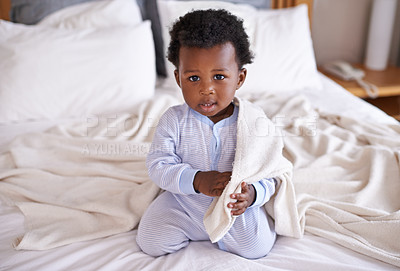 Buy stock photo Playful, portrait and baby with a blanket in bed, waking up and playing in his home. Face, sweet and african boy toddler in a bedroom curious, having fun and sweet, cute and enjoying a morning indoor