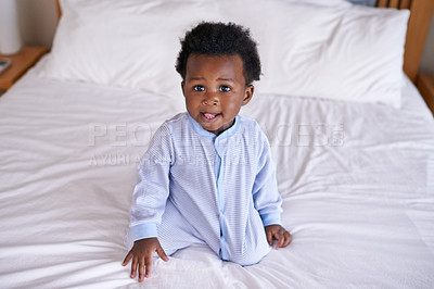 Buy stock photo Black baby boy playing in bedroom, sitting on the bed with early childhood development. African male toddler, cute curious child with growth and learning, childcare and relax at family home