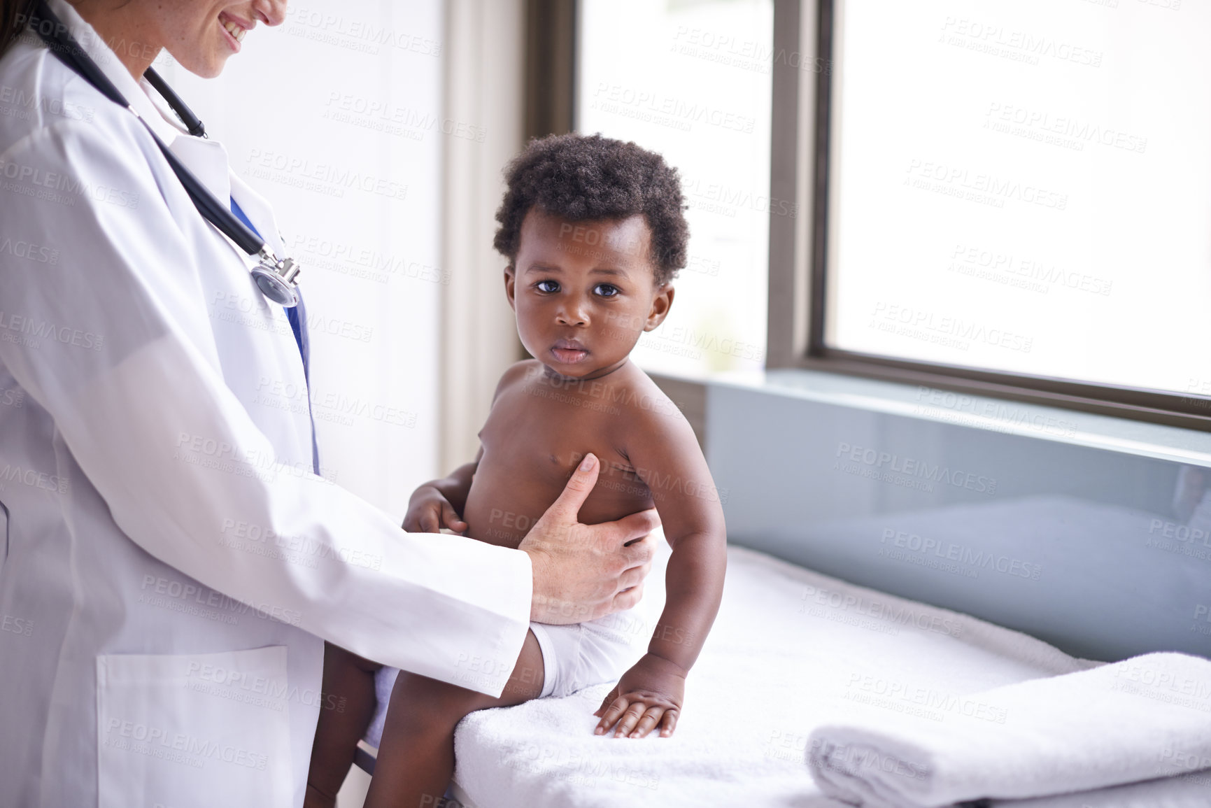 Buy stock photo Baby, pediatrician and healthcare wellness or consultation as childhood development checkup, examination or ill. Patient, kid and medic support on hospital bed in Kenya for diagnosis, flu or clinic