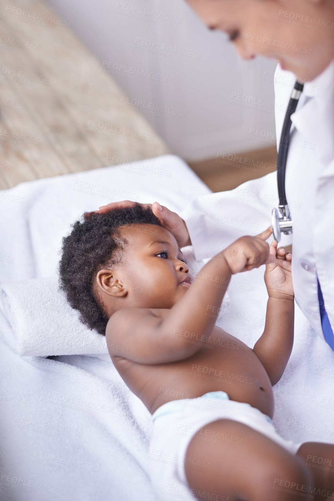 Buy stock photo Baby, pediatrician and healthcare consultation with stethoscope as childhood development, examination or ill. Patient, kid and doctor support on hospital bed in Kenya for diagnosis, flu or wellness