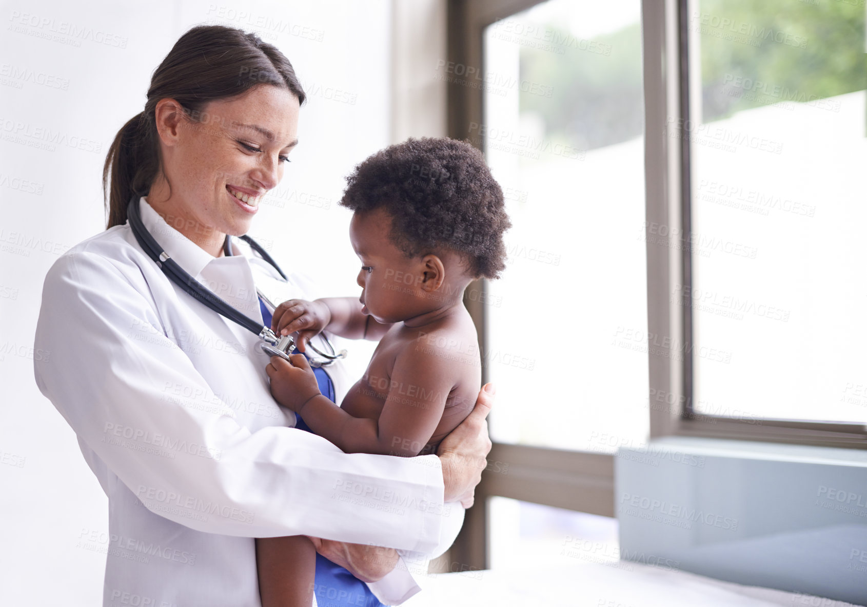 Buy stock photo Cropped shot of a female pediatrician doing a checkup on an adorable baby boy