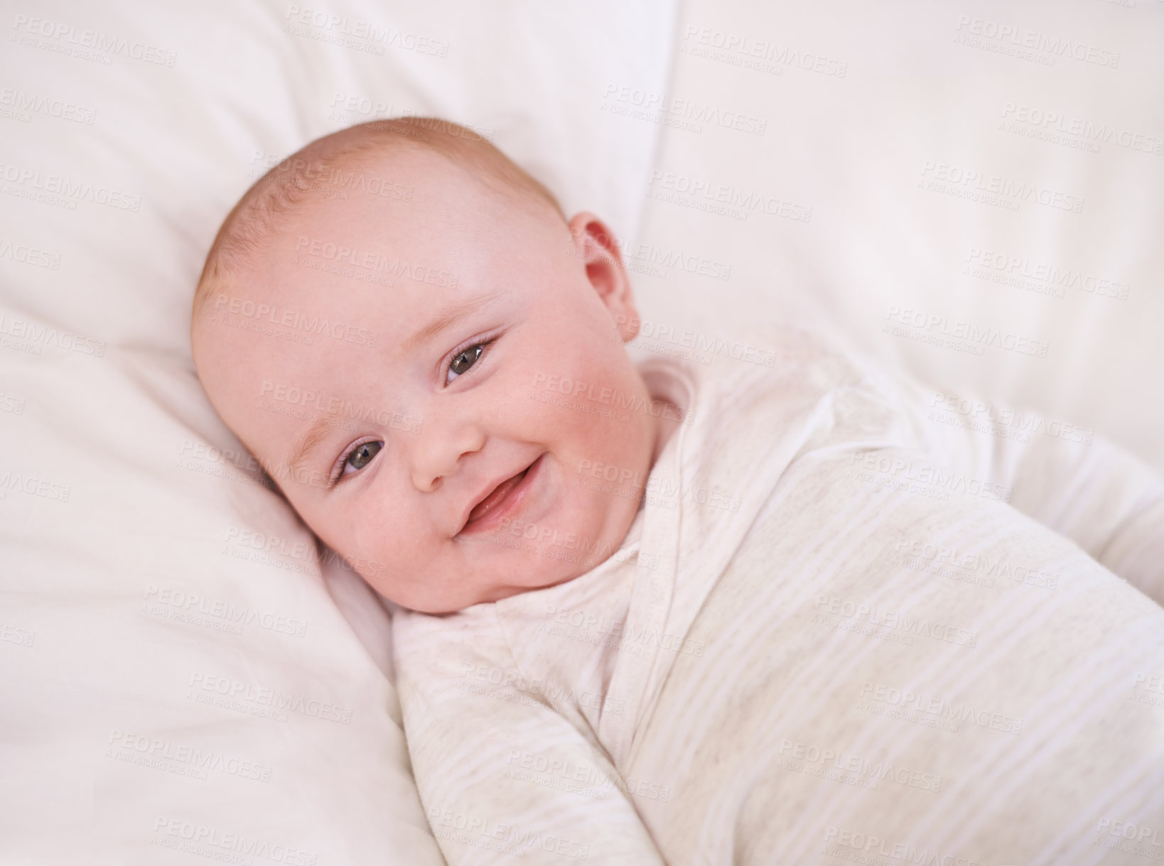 Buy stock photo Baby, portrait and smile on bed for relax comfort in family home for childhood development for growth, morning or care. Kid, boy and face on linen bedding in apartment with happiness, love or calm