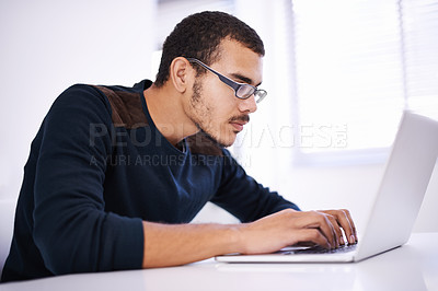 Buy stock photo University, desk and man with laptop for research, study or elearning with education, knowledge and opportunity. Computer, reading and college student writing report for online course with glasses.