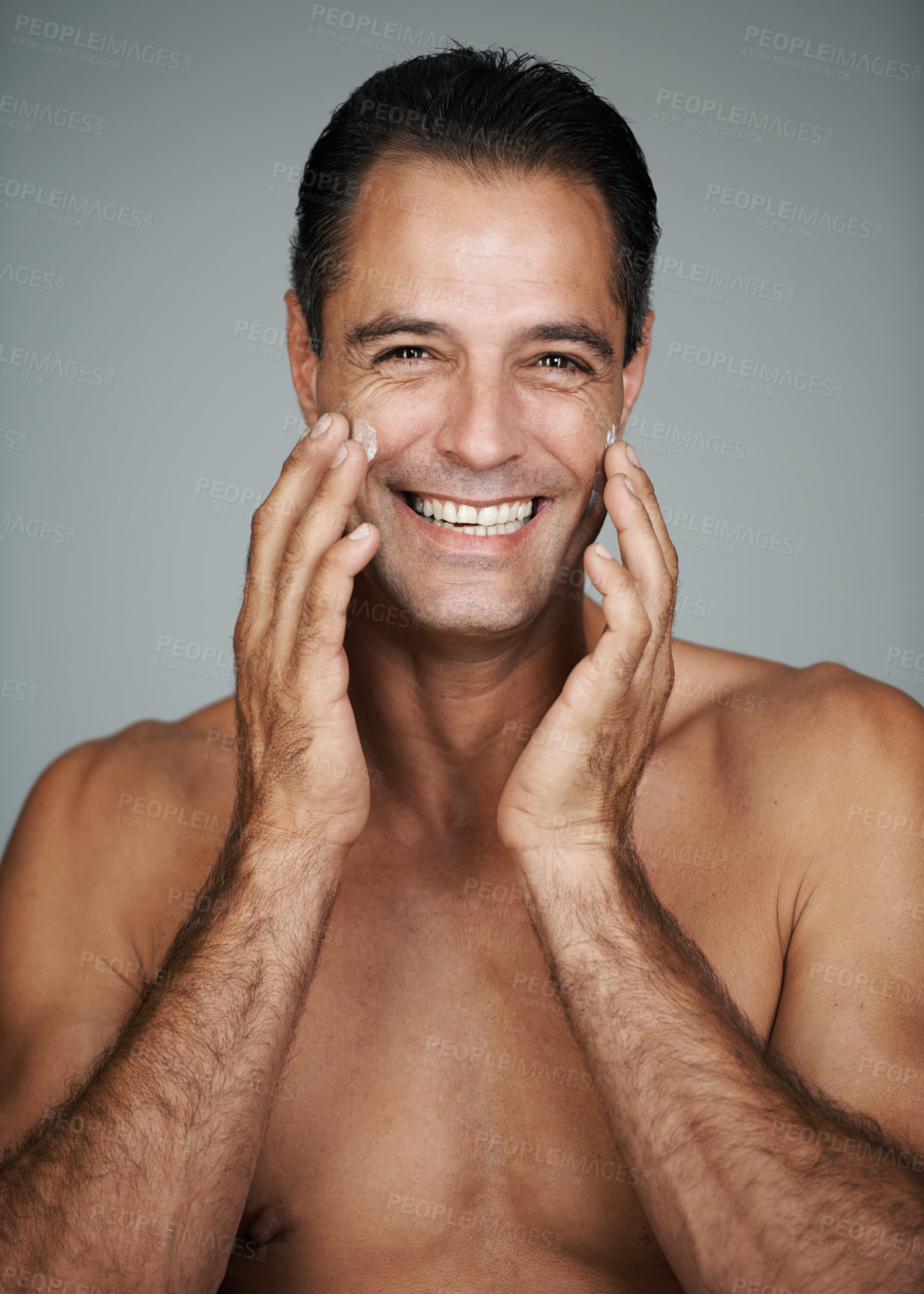 Buy stock photo Mature man, portrait and moisturizer in studio, beauty and collagen cosmetics for anti aging. Happy male person, treatment and dermatology on gray background, cream and apply lotion for hydration