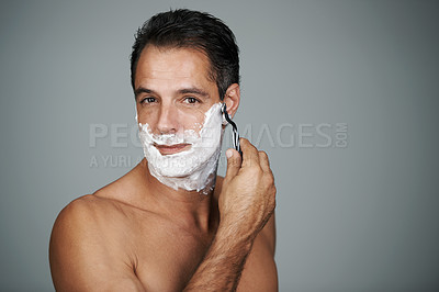 Buy stock photo Shaving cream, portrait and man in studio with razor for epilation or hair removal treatment. Skin, natural and face of mature person with shaver for facial dermatology routine by gray background.