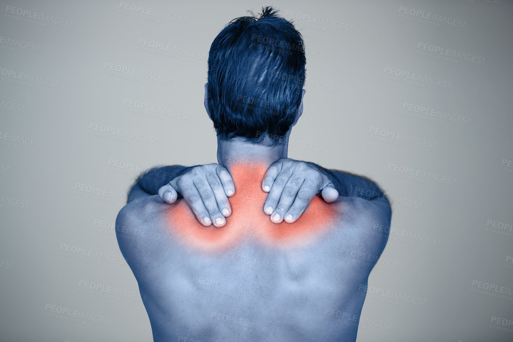 Buy stock photo Studio, man and hands for muscle or shoulder pain with tension or inflammation with discomfort, sprain and stress or strain. Red glow, back view and person with body ache or injury on grey background