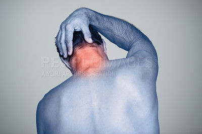 Buy stock photo Neck pain, injury and man with tension, inflammation and discomfort from stress, strain and pressure in back view. Male person, body and red glow for wound, bruise and trauma in studio background