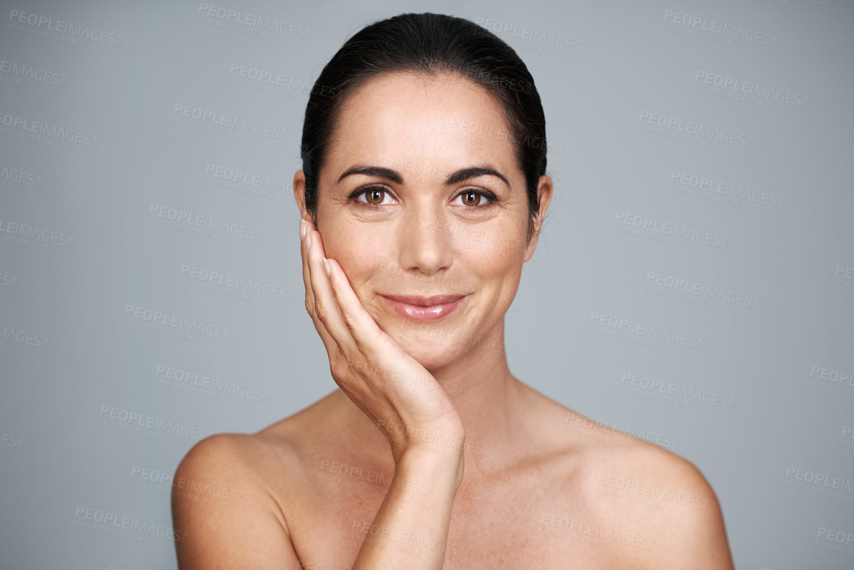 Buy stock photo Mature, skincare and portrait of happy woman touching face with makeup at studio isolated on gray background. Cosmetics, beauty and hand of model in facial treatment for dermatology or anti aging