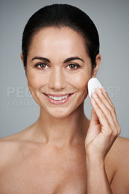 Buy stock photo Woman, pad and beauty in studio, portrait and facial treatment on gray background. Female person, skin care and cotton swab for grooming in daily routine, hygiene and dermatology to remove foundation