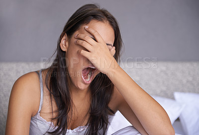 Buy stock photo Yawn, morning and woman tired in bed, unhappy and lazy to wake up from rest of sleeping. Home, female person and girl with fatigue or insomnia on soft mattress in bedroom to relax for health
