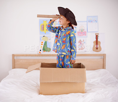 Buy stock photo A little boy playing pirate in a cardboard box