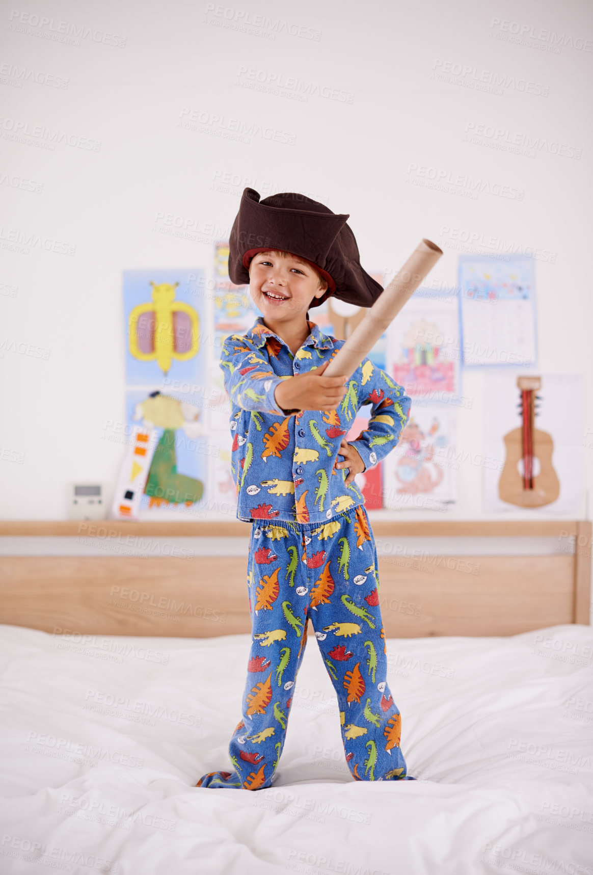 Buy stock photo House, portrait or costume as pirate to play in fantasy in a home with telescope toy or smile. Kid sailor, child captain or happy boy in a game with pyjamas, hat or creative monocular to sail on bed