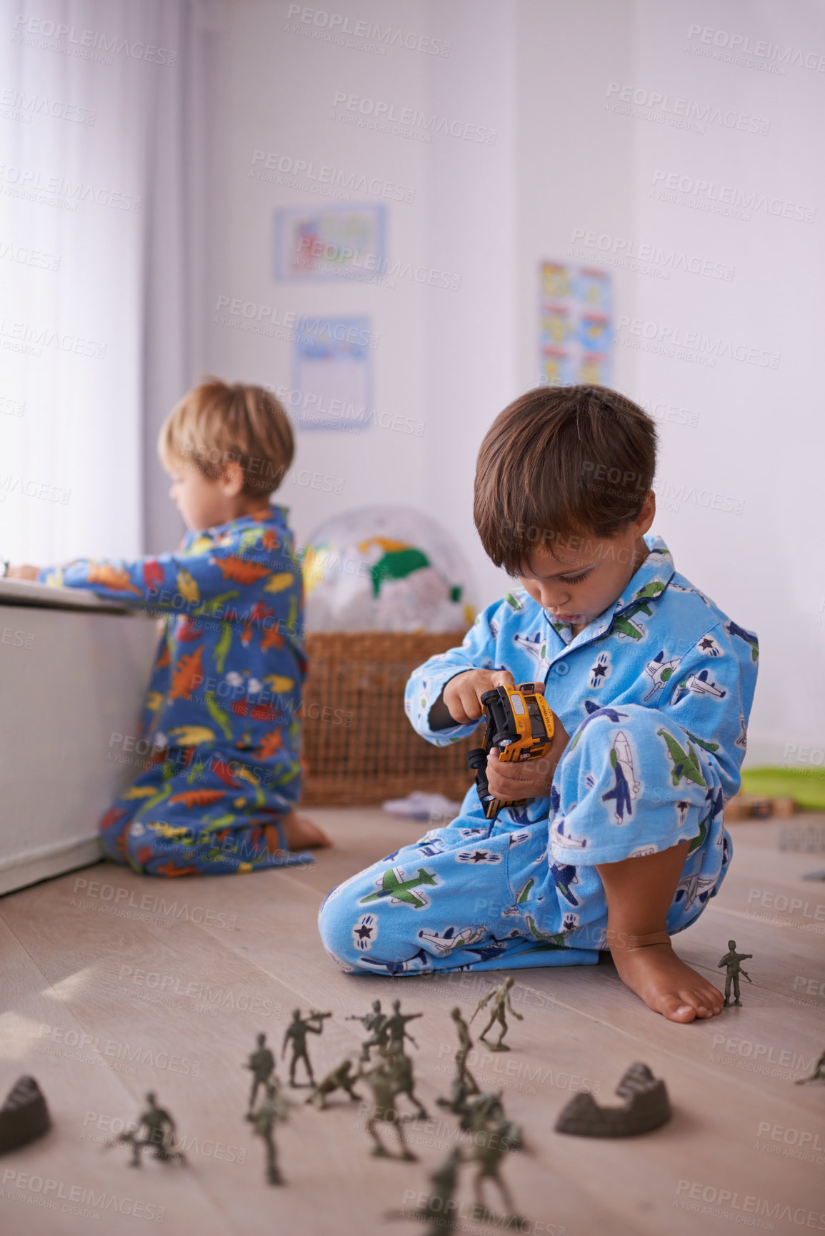 Buy stock photo Boys, toys and young children in pajamas playing for fun with action figures, car or games. Brothers, child development and young kids bonding together in playroom for learning at family home.