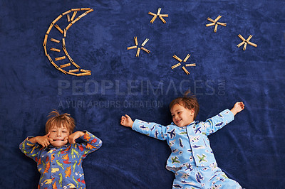 Buy stock photo Smile, playing and children with funny face for night, moon and stars carpet. Happiness, above view and siblings for playful facial expression, growth and childhood development in bedroom floor