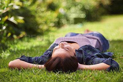 Buy stock photo Relax, sleep and woman on grass in nature for peace, dream and stress relief for summer holiday. Zen, female person and green lawn with resting for weekend enjoyment, nap and wellness in sunshine